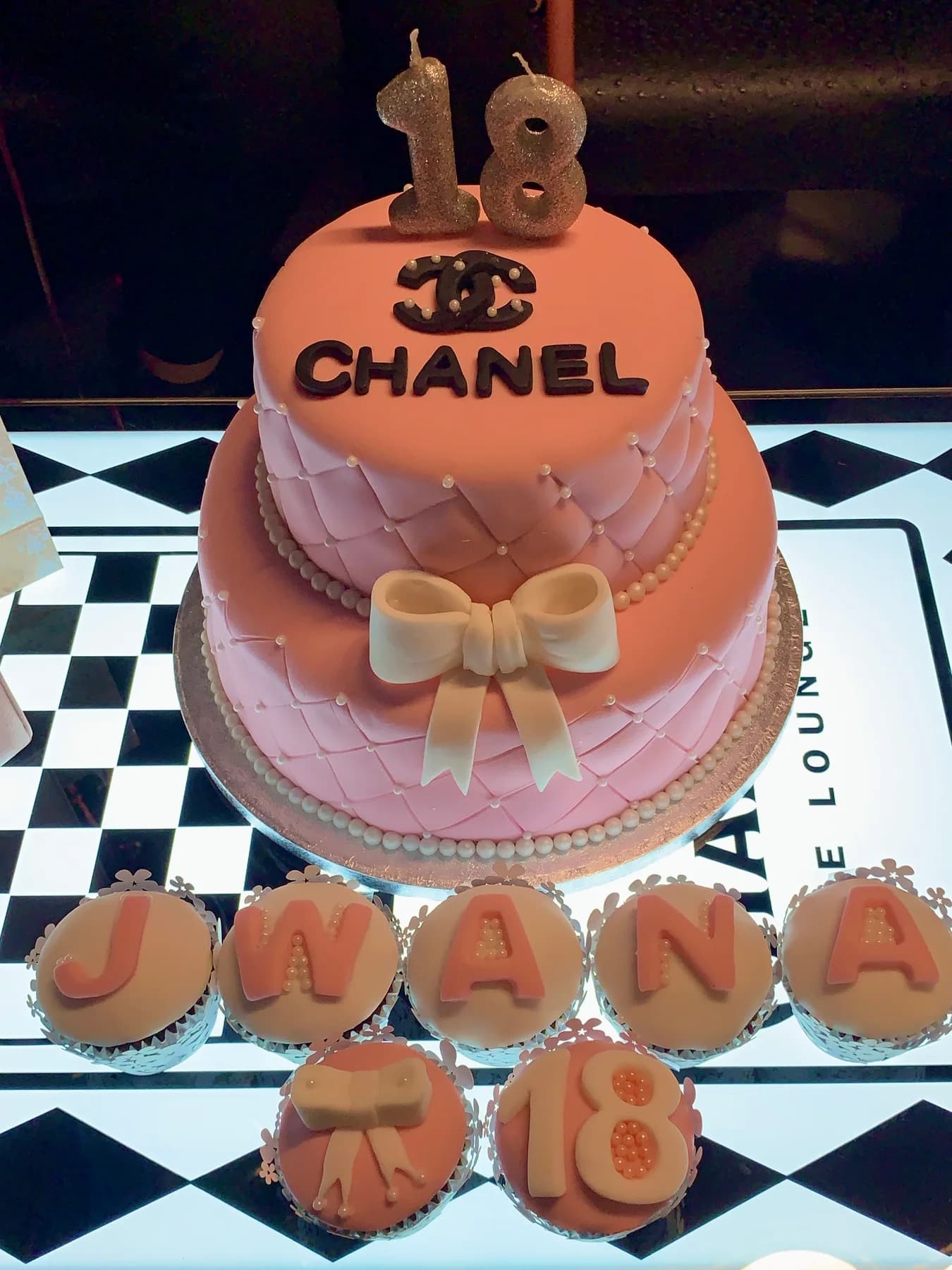 Pink celebration cake and matching cupcakes